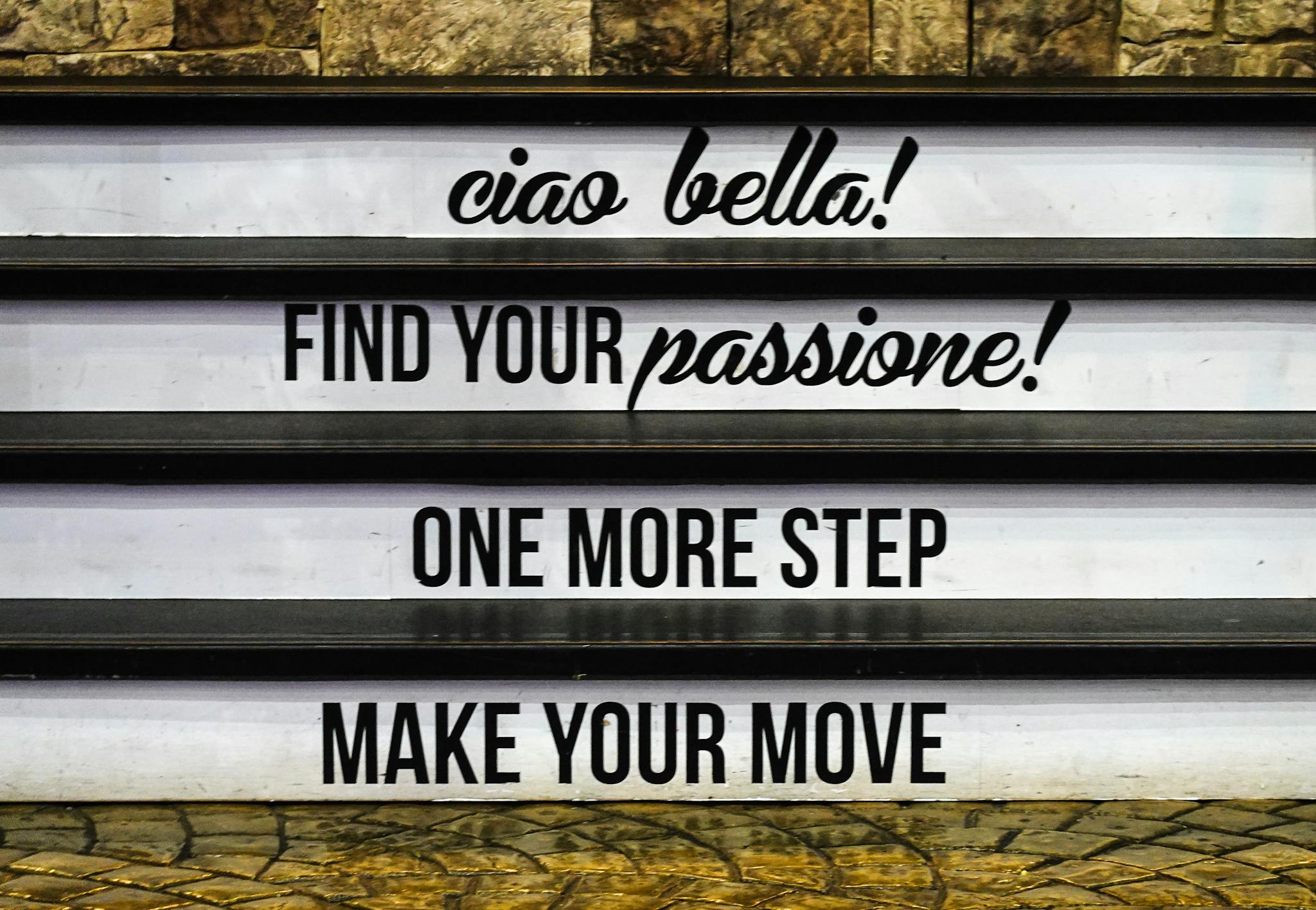 Inspirational messages displayed on stairs, encouraging motivation and positivity.